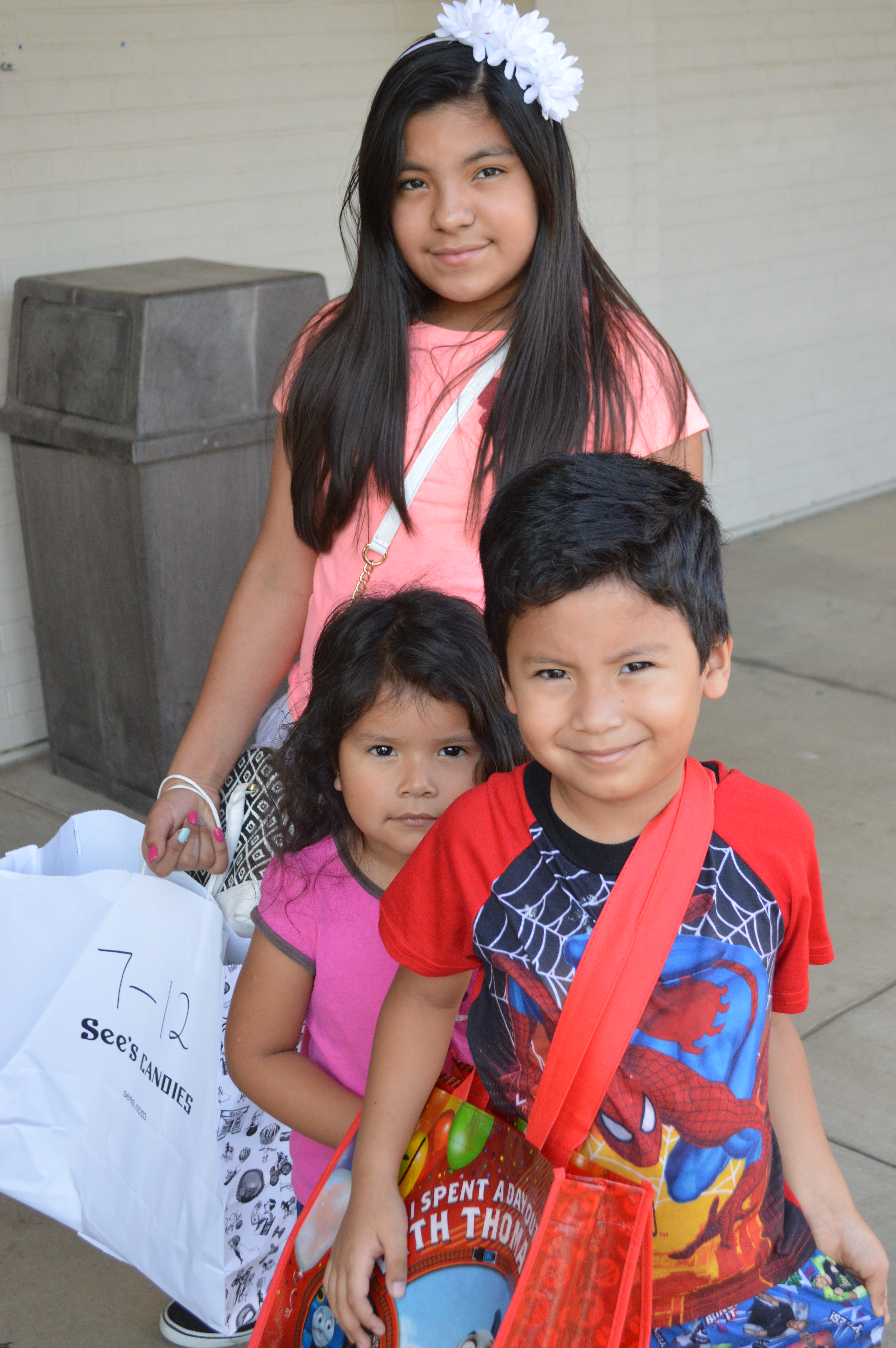 Children and youth receive school supplies as distribution begins