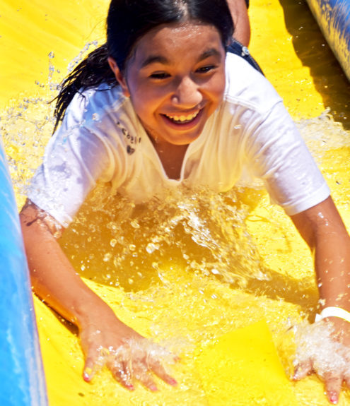 Keeping cool on a huge water slide at Summer Camp